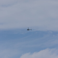 Fototapeta na wymiar Helicopter in full flight on a clear blue sky over Sydney Australia