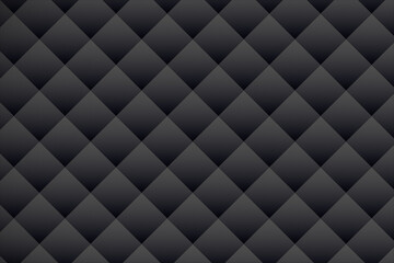 Fototapeta premium A dark gray geometric pattern of repeating triangular shapes creates texture