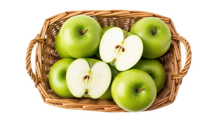 Isolated Granny Smith apples in wicker basket, cut fruit with seeds, fresh harvest bounty