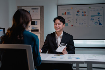 Financial advisor discussing data analysis with client