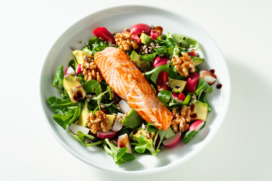 Nutritious Green Salad with Fried Salmon, Avocado and Nuts