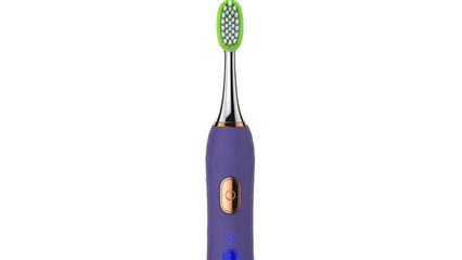 Isolated electric toothbrush standing upright, hygienic dental care and cleaning tool
