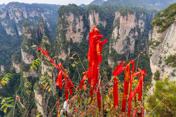 Tianzi, Hunan, China. 11-08-2024. Red ribbons tied to the trees in  the Tianzi Mountains (Avatars Mountains) in Zhangjiajie National Forest Park in Hunan, China.