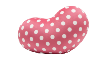 Isolated pink polka dot pillow in shape of a heart provides comfort and neck support