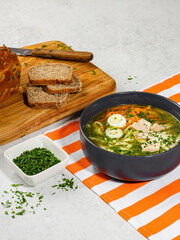 Classic Chicken Noodle Soup with Hard-Boiled Egg and Fresh Herbs