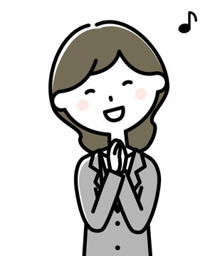 喜ぶスーツの女性