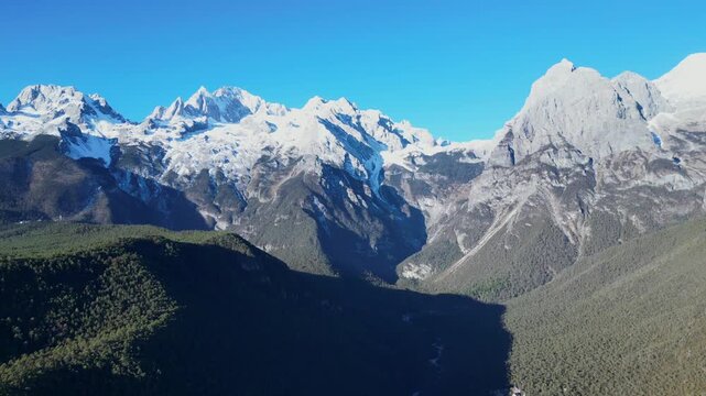 Aerial footage of the stunning scenery of Yulong Snow Mountain in Lijiang [4K60]