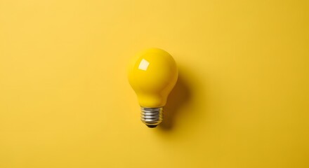 Single yellow light bulb on a bright yellow background idea concept