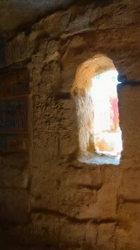Cave interior revealing ancient frescoes in a rock hewn sanctuary