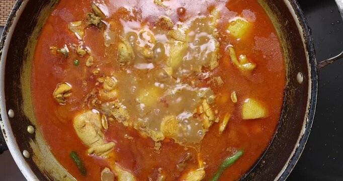 Bengali style spicy chicken curry stew with potato leg piece recipe ingredients tomato ginger gallic onion cumin coriander garam masala salt turmeric chili