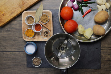 Bengali style spicy chicken curry stew with potato leg piece recipe ingredients tomato ginger gallic onion cumin coriander garam masala salt turmeric chili