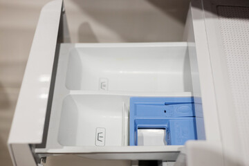 Modern drawer with blue detergent compartment