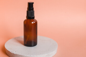 Different serum cosmetic bottles, white and dark brown dropper bottle container and packaging skincare product. studio pastel light background.