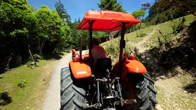 Tractor turning left on rural forest road