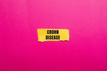 Crohn Disease message written on ripped torn paper background. Conceptual Crohn Disease symbol. Copy space.