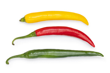 Chili peppers displaying vibrant red, yellow, and green colors on a white background
