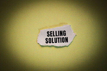 Selling Solution message written on ripped torn paper background. Conceptual Selling Solution symbol. Copy space.
