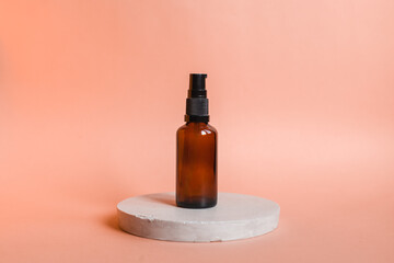 Different serum cosmetic bottles, white and dark brown dropper bottle container and packaging skincare product. studio pastel light background.