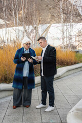 Two People Engaged in Discussion Outdoors