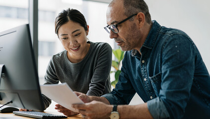 Business colleagues collaborating on project planning in office