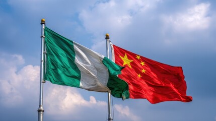 Flags of Nigeria and China waving together under a cloudy sky during a national event or celebration