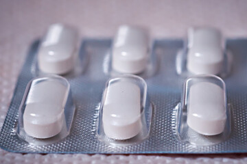 Pills in blister pack close-up. Side view