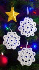 three white crocheted snowflakes and one gold star ornament hanging on the christmas tree