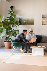 Two people discussing at a modern workspace