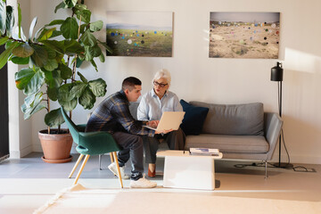 Two People Collaborating in Modern Living Room