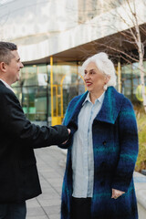 Business Meeting Between Two Professionals Outdoors