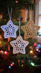 white crocheted snowflakes and one gold star ornament hanging on the christmas tree
