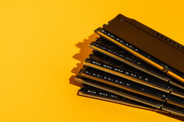 Fan arrangement of RAM sticks on yellow background. High quality photo