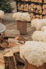 Cozy Outdoor Fire Pit with Wooden Stools and Winter Holiday Atmosphere