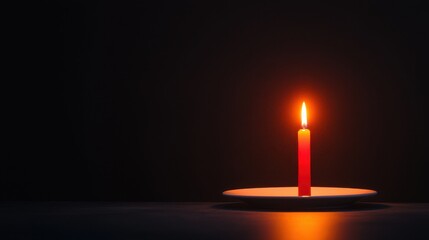 Single Red Candle Illuminating Darkness on Plate in Soft Warm Light