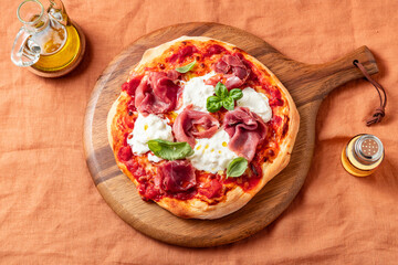 Pizza with Prosciutto Crudo, Stracciatella Cheese and Basil