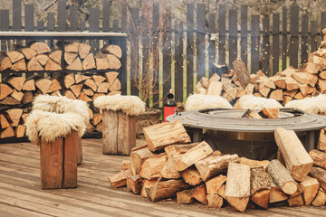 Cozy Outdoor Fire Pit with Wooden Stools and Winter Holiday Atmosphere