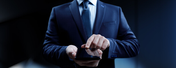 Businessman pressing button on virtual screen, Innovation and Digital Touch Interaction on Futuristic Technology Interface.