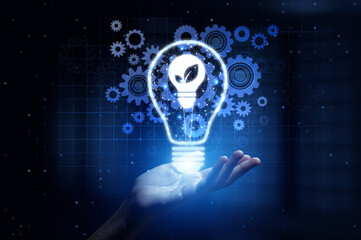Green Energy Promoting Sustainable Power Solutions with Human Hand Holding Lamp Hologram.