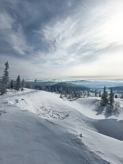Mountain view with snowy slopes and distant ranges