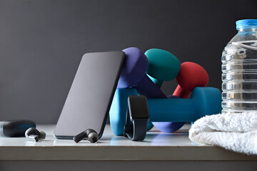 Sports background with portable electronic training devices and sports equipment