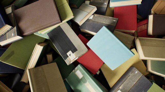 Camera High angle Rotation stack of books. 3D animation. 4K.