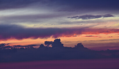 Breathtaking nature scene: serene cloudscape capturing the powerful sunset glow