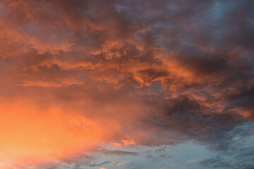 Serene late afternoon sky glowing with dramatic, magical sunset colors