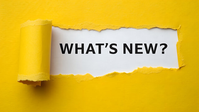 Torn yellow paper revealing the text whats new question on a white background for announcement or update concept