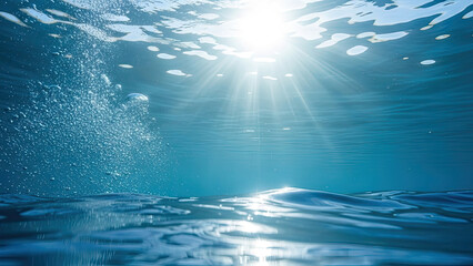 Sunlight shining through the water surface into the ocean