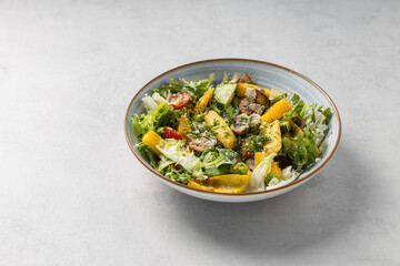 Healthy vegetable salad in ceramic bowl with copy space