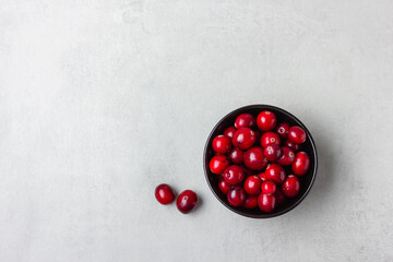 Cranberries in black bowl top view