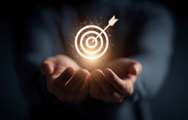 Glowing Target Icon Held in Hands