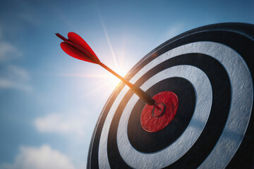Red arrow hitting center of target outdoors