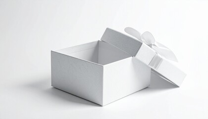 Light brown gift box with darker ribbon, lid ajar revealing shredded filler, casting soft shadow on white surface.